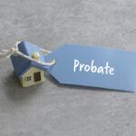 Toy House with a blue tag Displaying the Word 'Probate'